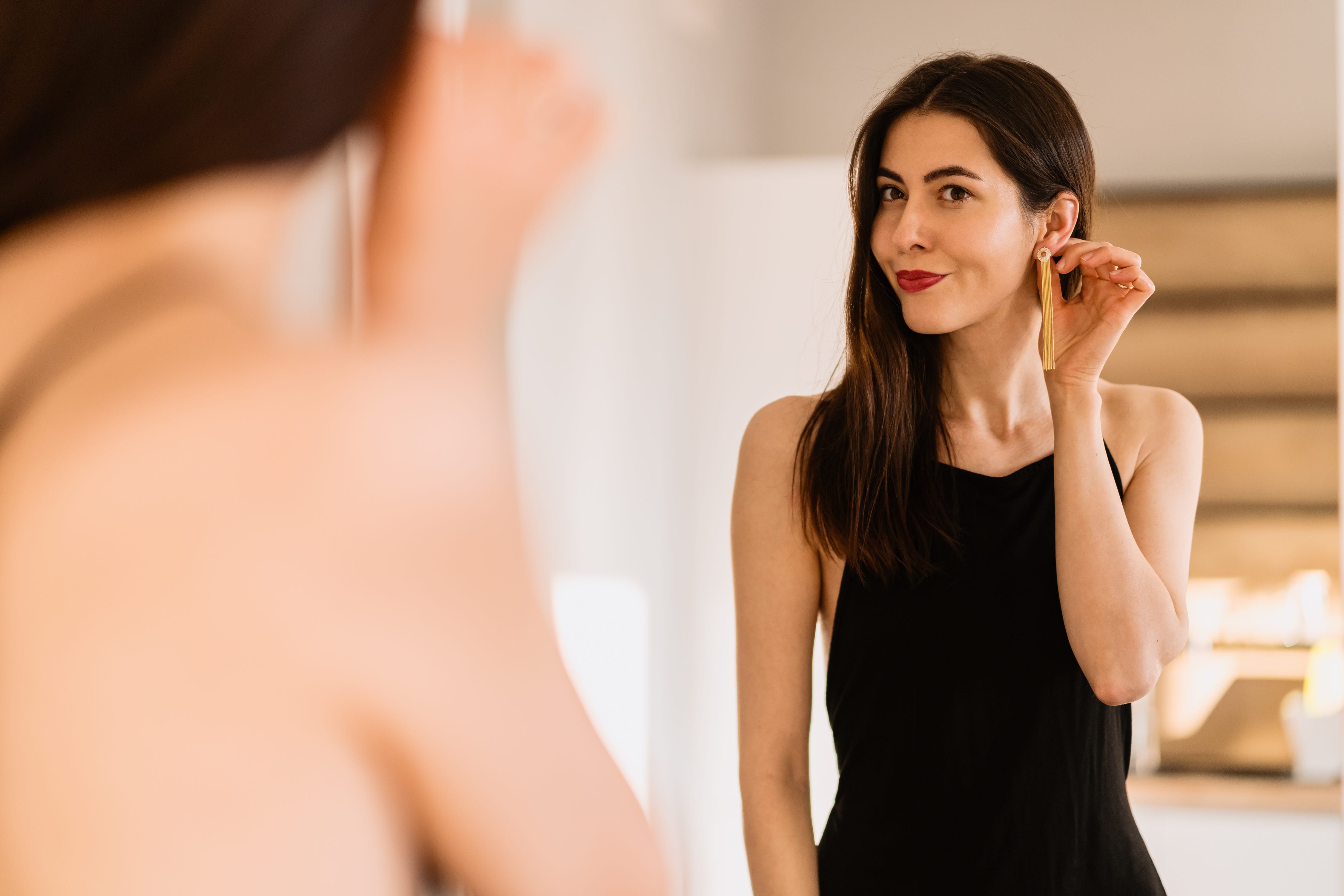 Woman wearing a dress getting ready for an event.jpeg